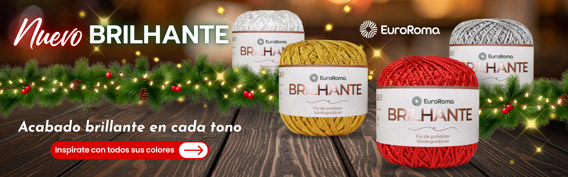 Ovillos EuroRoma Brilhante en colores blanco, dorado, rojo y plateado sobre fondo navideño con luces y ramas.