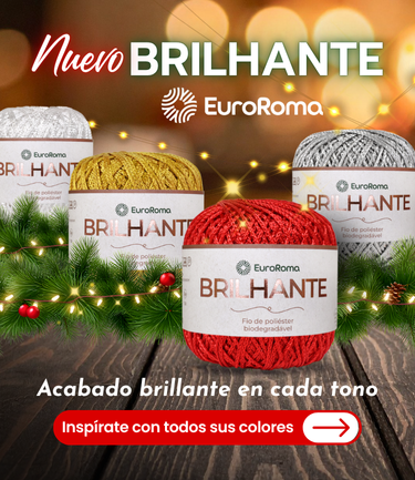 Ovillos EuroRoma Brilhante en colores blanco, dorado, rojo y plateado con fondo navideño y luces.
